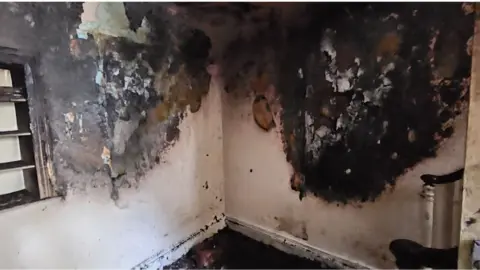 Devon and Somerset Fire and Rescue Service Damaged hallway