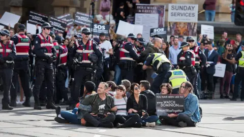 EPA Police move in on animal rights protesters sitting on roads in the middle of Melbourne