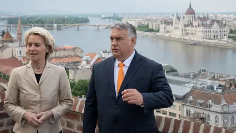 Hungarian PM press office Hungary"s Prime Minister Viktor Orban and European Commission President Ursula von der Leyen meet in Budapest, Hungary, May 9, 2022