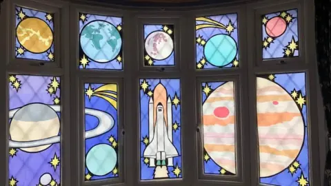 Hilary Hopker Space-themed window art