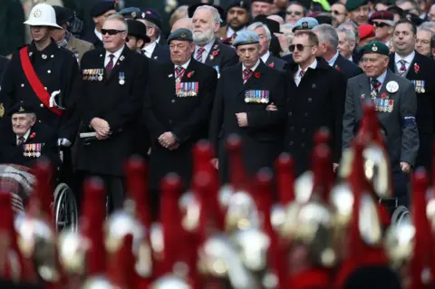 PA Veterans attend the remembrance service at the Cenotaph memorial in Whitehall