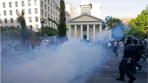 Getty Images Protesters were pepper sprayed to clear a path for Mr Trump's church visit