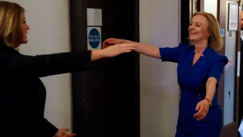 Reuters Penny Mordaunt and Liz Truss about to hug