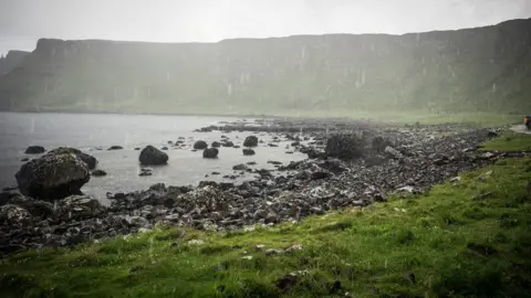 Getty/mikedabell The Giant's Causeway is a landmark in Antrim , Northern Island of 40,000 interlocking basalt columns, the result of an ancient volcanic eruption.