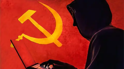 Getty Images The old Communist Russian hammer and sickle is seen in the background of a silhouetted "hacker" caricature wearing a hoodie