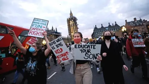 Getty Images Protestors holding placards march on to Westminster Bridge as they demonstrate against the government's Police, Crime, Sentencing and Courts Bill