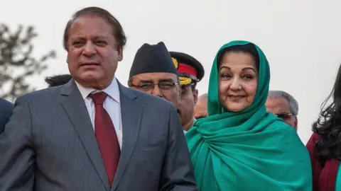 Getty Images Prime Minister of Pakistan Nawaz Sharif poses with his wife, Kulsoom Nawaz Sharif, upon his arrival for the 18th SAARC Summit on 25 November 2014 in Kathmandu, Nepal