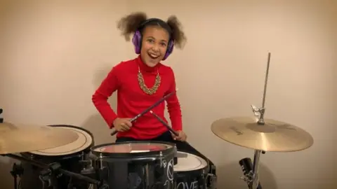 YouTube/Nandi_Bushell Nandi on the drums