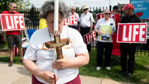 SAUL LOEB/AFP/Getty Images Anti-abortion demonstrators hold a protest outside the Planned Parenthood Reproductive Health Services Center in St. Louis, Missouri, May 31, 2019, the last location in the state performing abortions