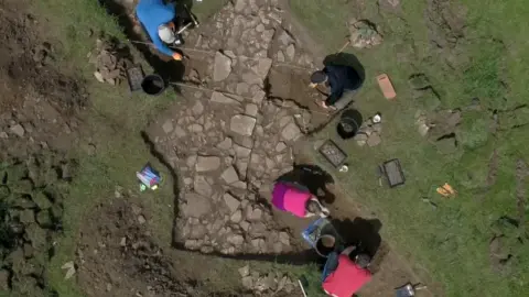 People excavating a site in Colleyweston