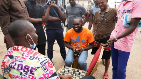 Reuters Men playing chess at a polling station in Awka, Anambra state, Nigeria - Saturday 25 February 2023