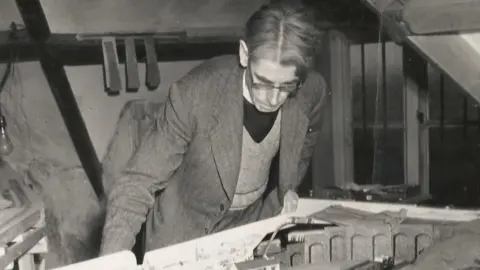 Awdry family Wilbert Awdry looking down at the railway set he used to help plan his stories