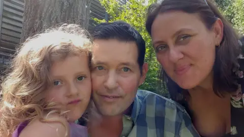 Thom family Marc Thom with his daughter, Taylor, and wife, Celeste