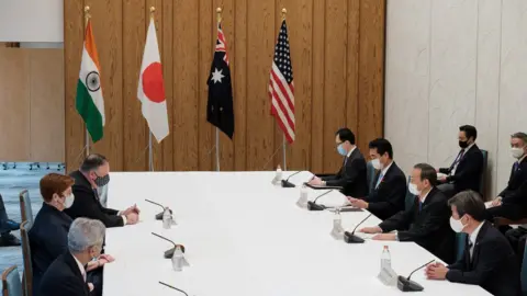 Getty Images Foreign ministers from India, Japan, Australia and the US sit around a table at security talks this week