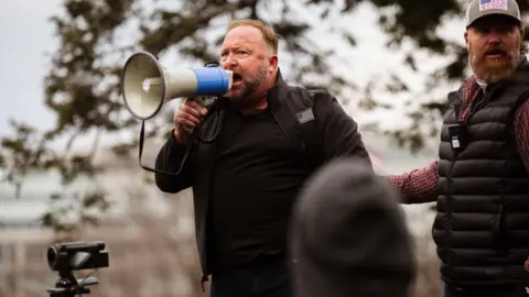 Getty Images Right-wing radio host Alex Jones addressed the crowd ahead of the riot