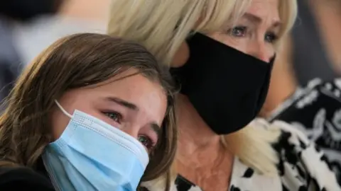 EPA Relatives of the victims have been marking the first anniversary of the killings