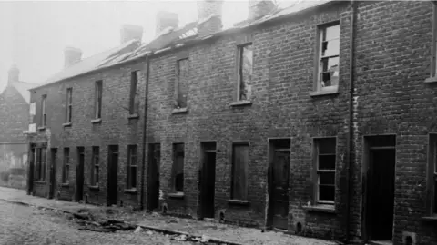 Getty Images Catholic families were forced out of their homes in some areas, including in Antigua Street in Belfast in May 1922