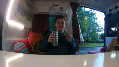 Caolán McLaughlin Caolan eating in van