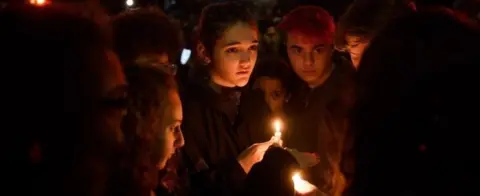 Getty Images People at a vigil in Pittsburgh's Squirrel Hill