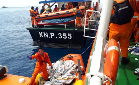 BBC Search and rescue officials in the sea off Jakarta