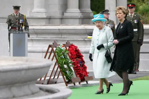 Getty Images Queen Elizabeth II and then Irish President Mary McAleese at the Irish War Memorial Garden