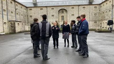 BBC Pupils taking part in session outside Shepton Mallet prison.