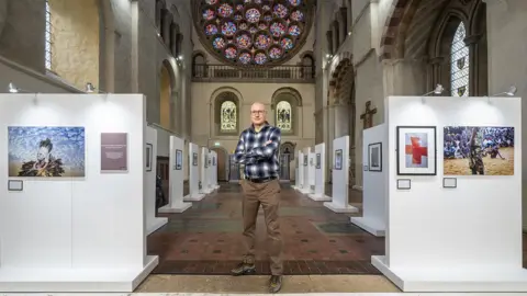 Jonathan Banks Jonathan Banks with his exhibition in St Albans Cathedral