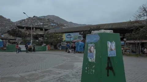 Florence Goupil A "Missing" poster of Alison Fernandez (30), who on the morning of August 13th went out to the local market and did not return home. In the background, the market of Villa Maria del Triunfo neighbourhood, where she was last seen.