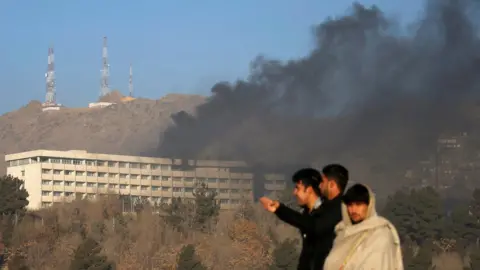 Reuters Smoke rises from the Intercontinental Hotel during an attack in Kabul, Afghanistan January 21, 2018.