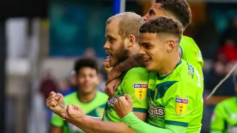 Rex Features Teemu Pukki (left) celebrates his goal for Norwich City