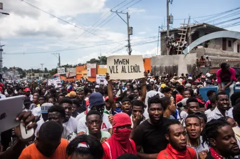 Getty Images Protesters march in Haiti