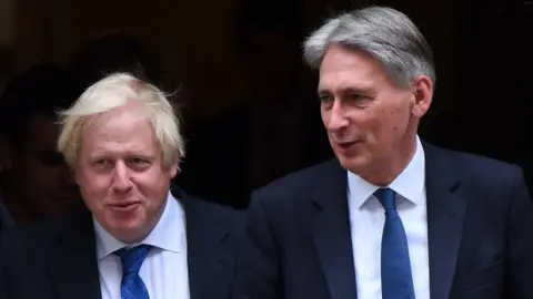 AFP/Getty Images Boris Johnson and Philip Hammond
