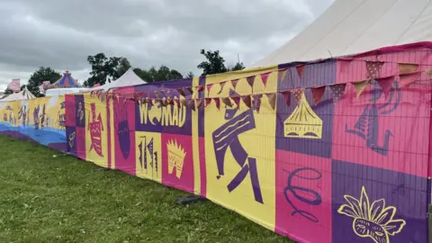 A colourful fence at Womad festival