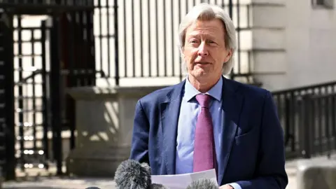 Pacemaker Arlene Foster's lawyer Paul Tweed speaking to reporters outside the court in Belfast