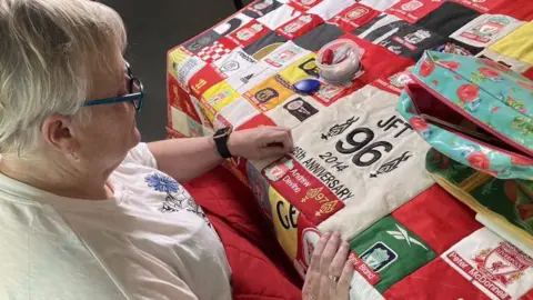 National Museums Liverpool Linda Whitfield with the quilt