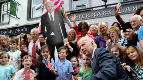 MerrionStreet.ie Joe Biden posing for a photo with residents in Ballina in 2016