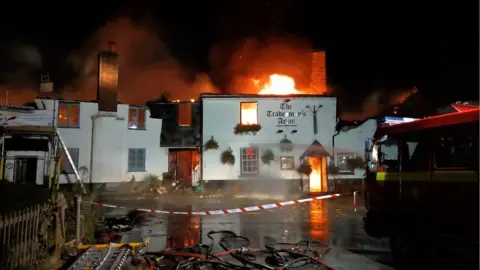 Devon and Somerset Fire and Rescue Service Tradesman's Arms pub in Stokenham on fire