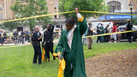 Getty Images Image shows scene of shooting outside the Altria Theatre after the Huguenot High School graduation ceremony