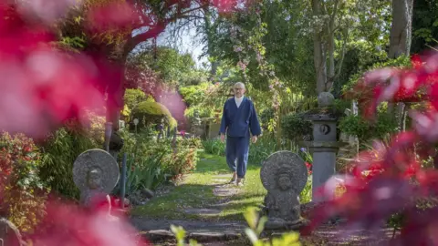 Getty Images Buddha Maitreya walking through his garden