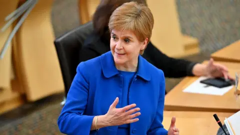 Getty Images First Minister Nicola Sturgeon announces her plans to halt the spread of coronavirus at the Scottish Parliament on September 22, 2020