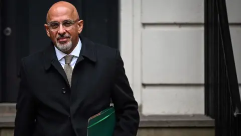 AFP Britain's Minister without Portfolio and Conservative party chairperson Nadhim Zahawi leaves the party head office in London, on January 24, 2023.
