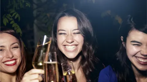 Empics Women drinking sparkling wine