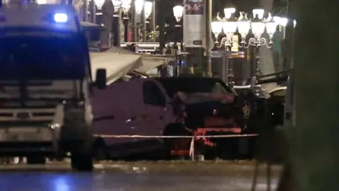 AFP A van being towed away