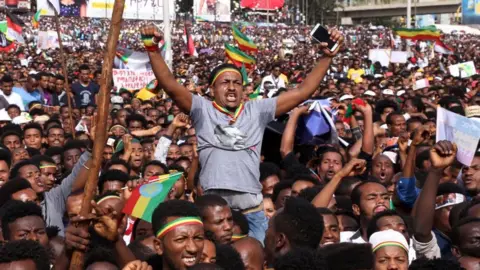 Getty Images Cheering supporters of PM Abiy