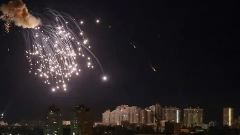 Reuters A drone exploding in the night sky over Kyiv, 10 September 2023