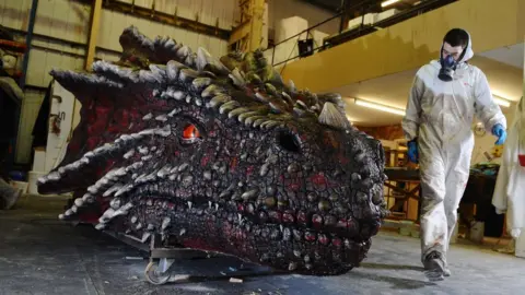 Cadw An artist with a dragon's head