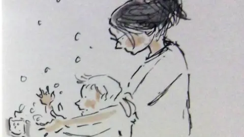 Angie Stevens/ Wales News Service Angie and her son Gruff wash their hands