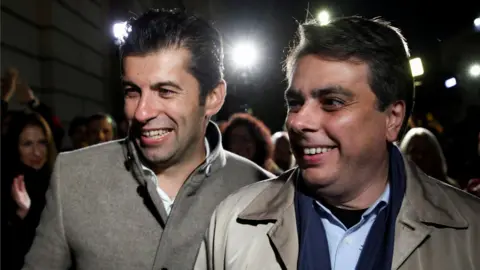 Reuters Kiril Petkov (L) and Assen Vassilev, leaders of Bulgaria's new centrist party "We Continue the Change", react after the first exit polls during parliamentary and presidential elections on 14 November