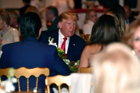 Getty Images Trump with wife Melania at dinner in Mar-a-Lago