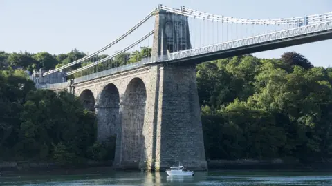 Rupert Jones All creatures great and small... Rupert Jones captures this boat fishing under the grand Menai suspension bridge